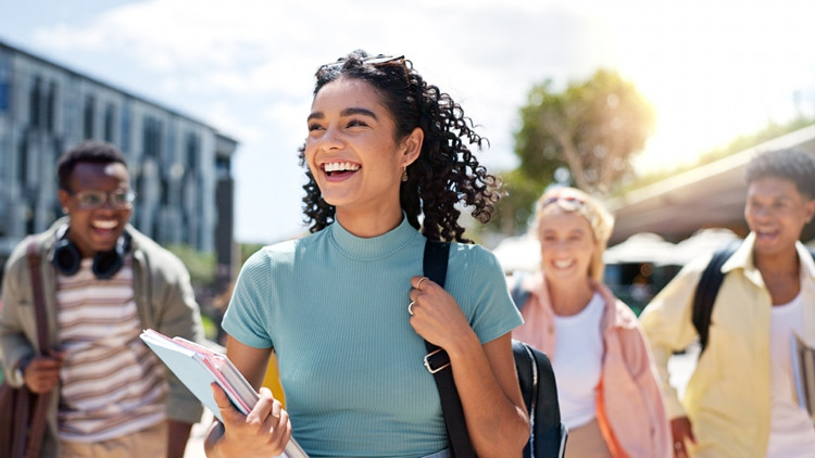 Post-secondary students walking together on campus