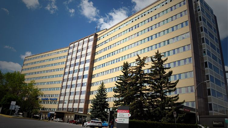 Photo of the Foothills Medical Centre, showing the Hospital building exterior with "Emergency" sign.