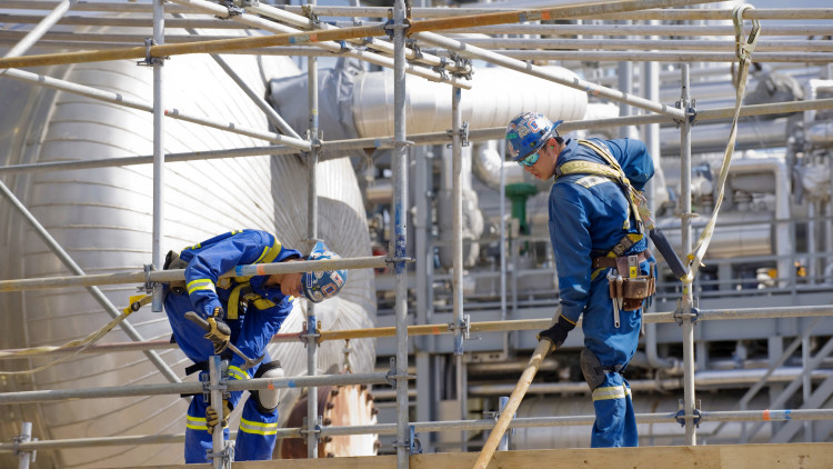 Photo of 2 men working