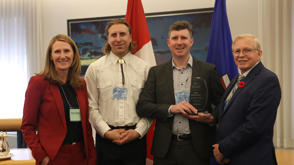 From L to R: Sherri Wilson, Deputy Minister of Advanced Education, Sam McGowan, Matthew McGowan (accepting on behalf of their father, Mick McGowan), Ray Massey, Board Chair, Alberta Board of Skilled Trades