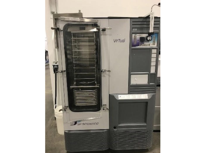 Close-up of freeze dryer on left and SPX spray dryer on right