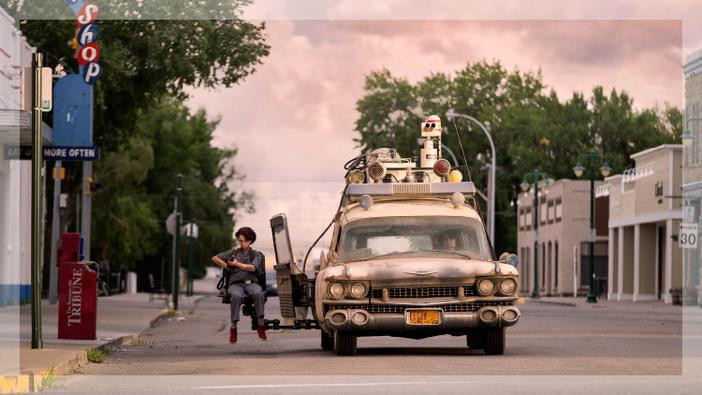 Phoebe Spengler sitting in the Ecto-1 gunner seat