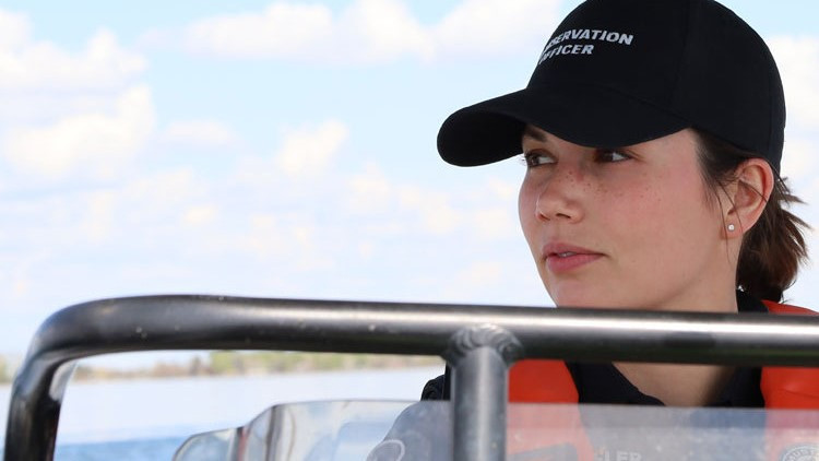 Conservation officer conducting a boat patrol.