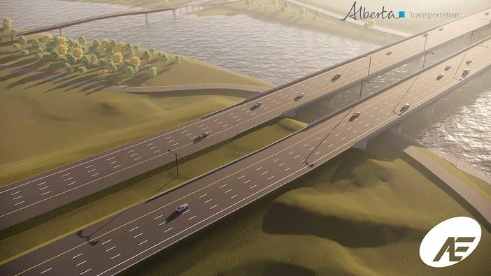 Overhead view looking southwest of twinned bridge over the Bow River with pedestrian bridge in background.