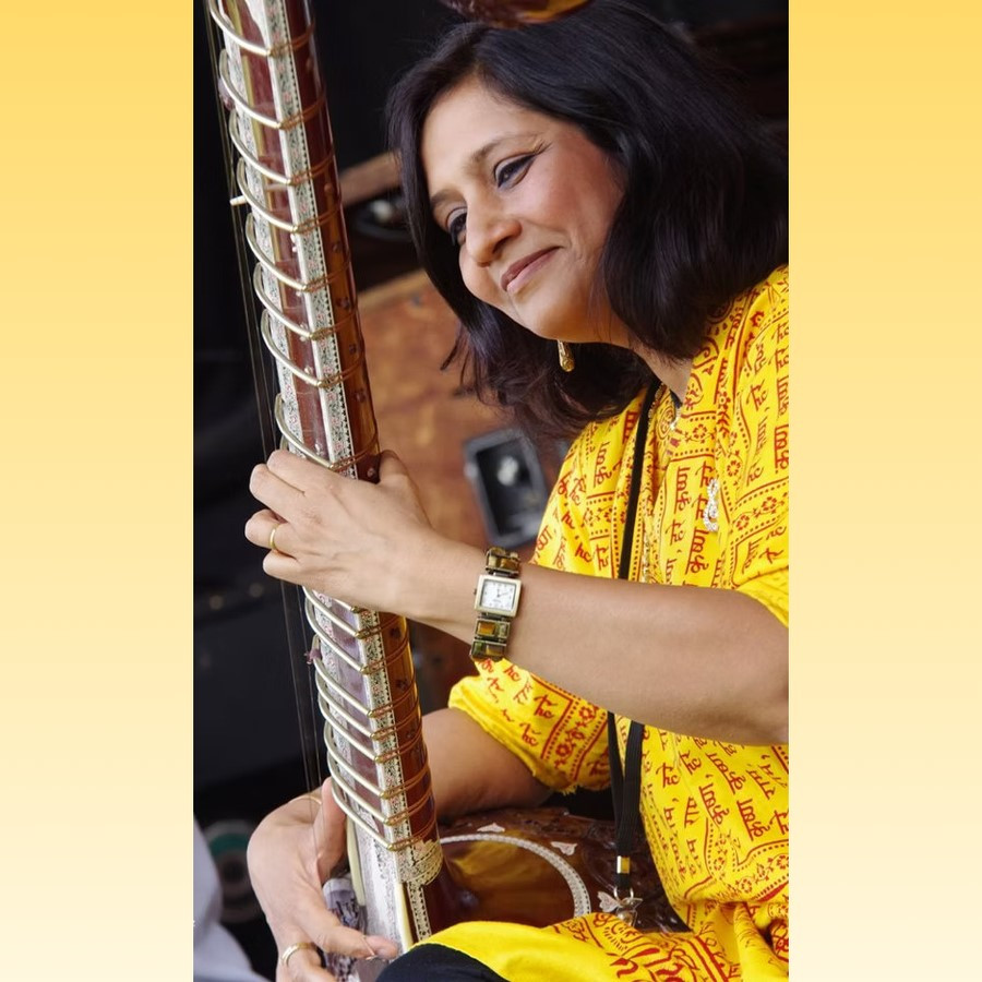 Sharmila Mathur is playing the musical instrument, the Sitar
