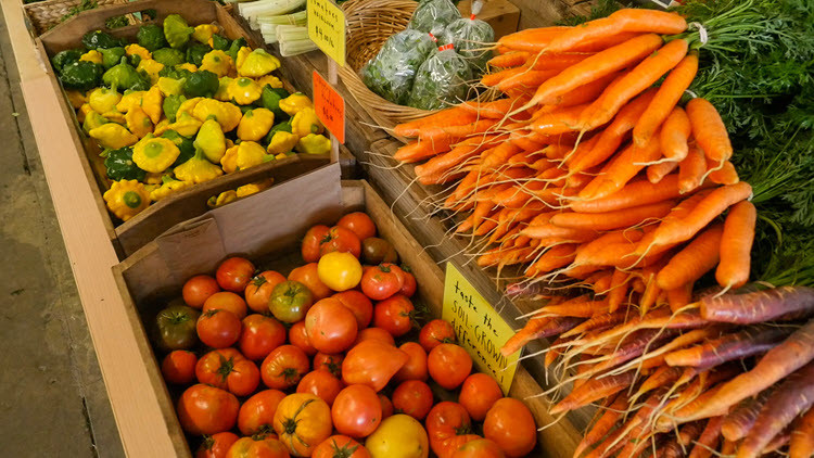 Photo of vegetables at a farmers market.