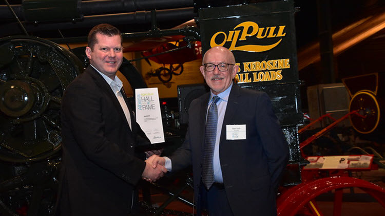 Minister of Agriculture and Irrigation shaking hands with Blair Roth