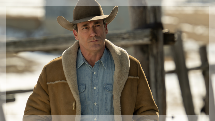 Close-up of cowboy with heavy coat and hat.