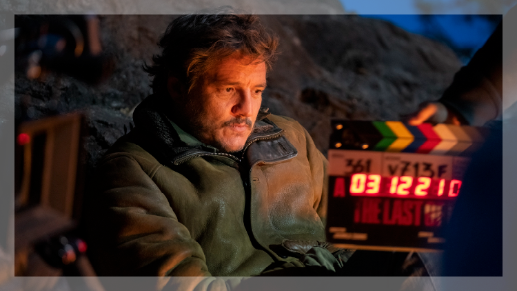 Man in twilight with film clapboard in foreground that says Last of Us.