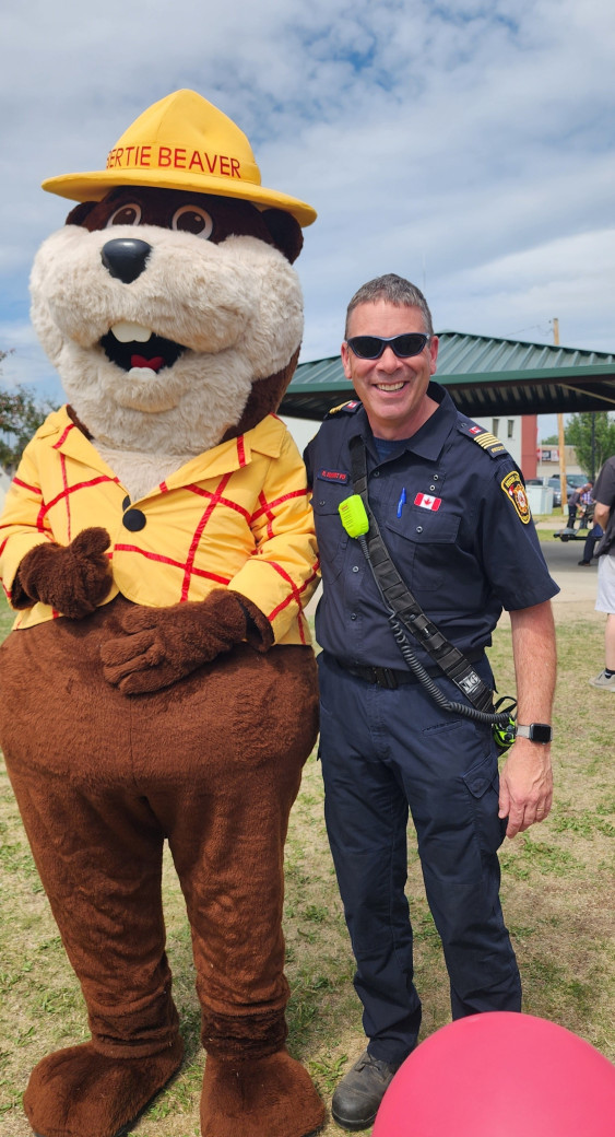 Bertie with High Level fire chief (July 1, 2025)