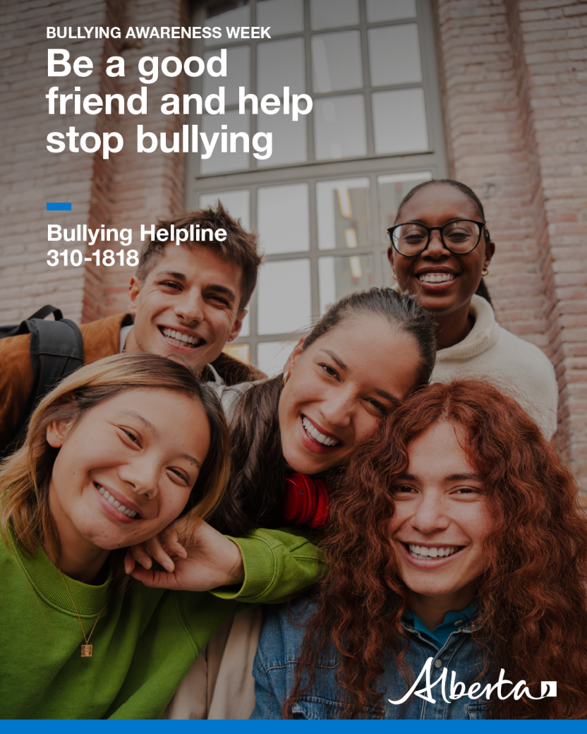 Image of a diverse group of five friends close together smiling at the camera.