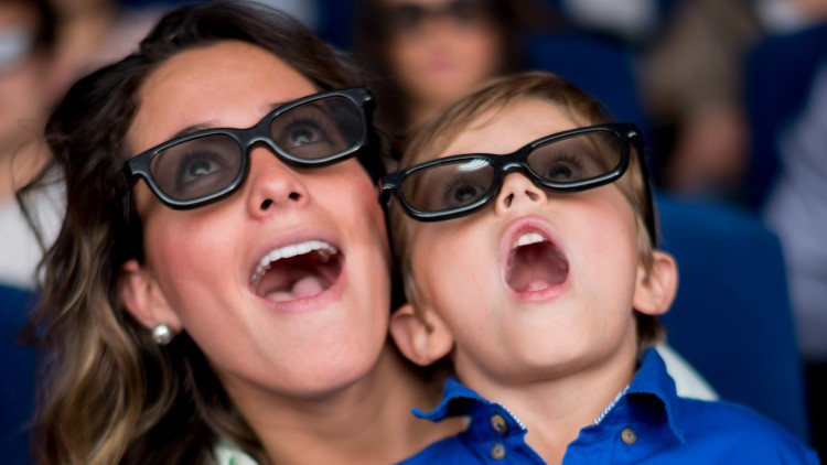 A photo of a woman and child looking up