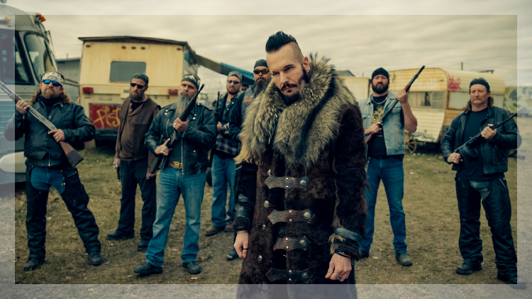 Gang of bearded men holding guns in a scene from Wynonna Earp