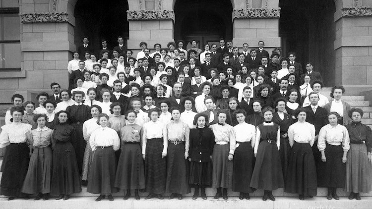 Teachers standing on steps in front of Alberta Normal School, 1909.