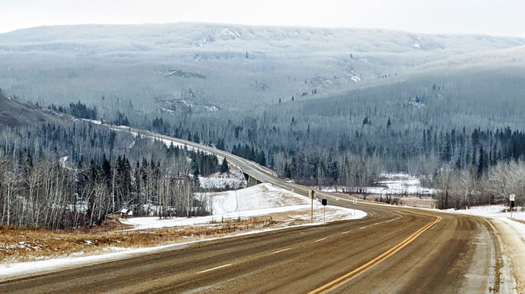 Single lane highway near Medicine River looking east.