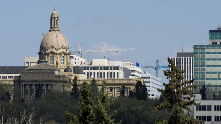 Photo of the legislature building and downtown buildings