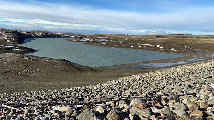 Saint Mary Reservoir - waterbody surrounded by land and rocks