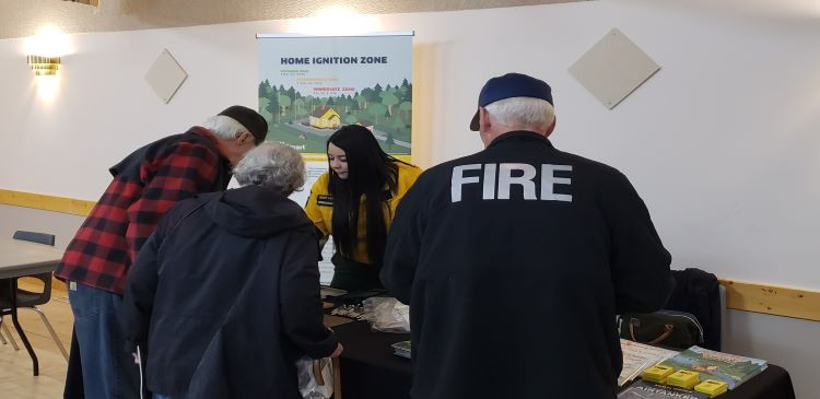 forestry staff sharing firesmart information with residents 