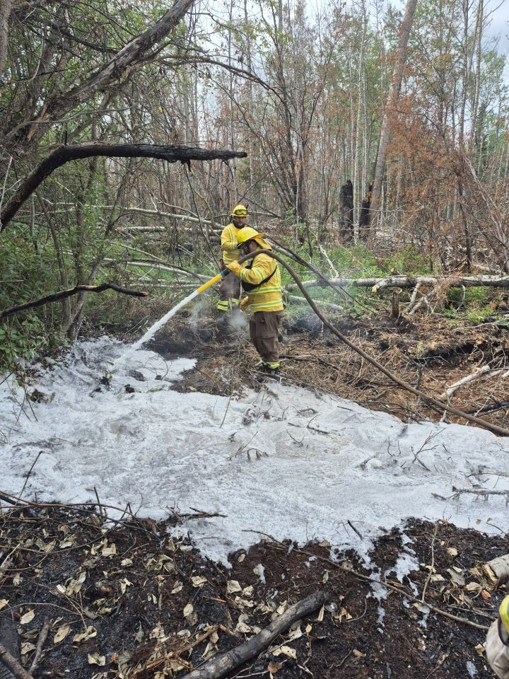 Firefighter using foam 
