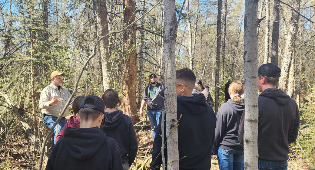 Forester speaks with students at Machesis Lake in May 2025
