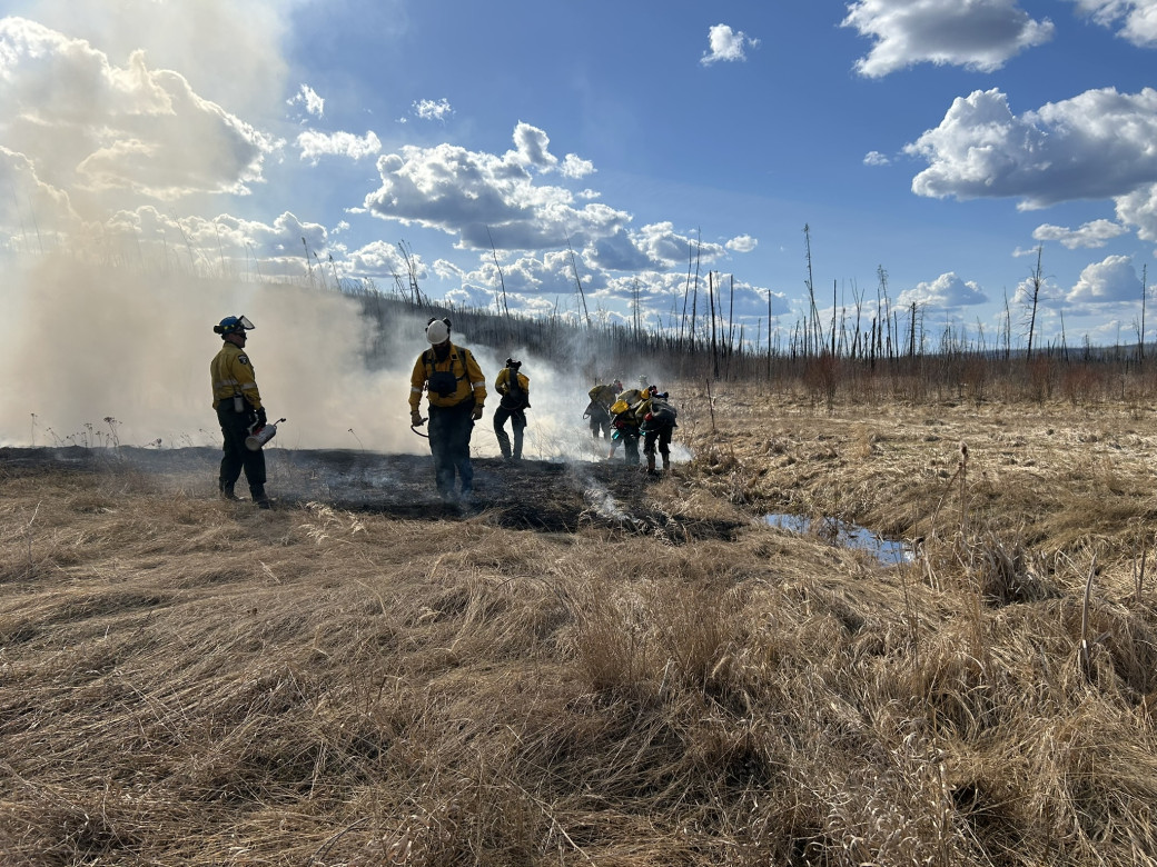 Firefighters complete a hazard reduction burn near Saprae Creek Estates in Fort McMurray to reduce wildfire risk