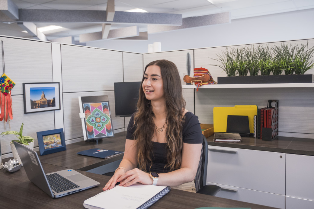 Intern works at a desk.