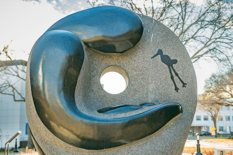Photo of the residential school monument depicting a feminine figure holding a baby.