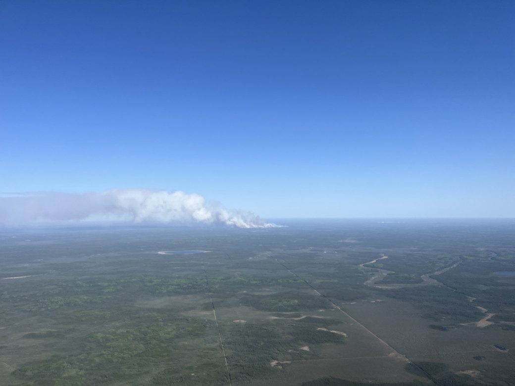 A large plume of smoke can be seen in the Cold Lake Air Weapons Range 