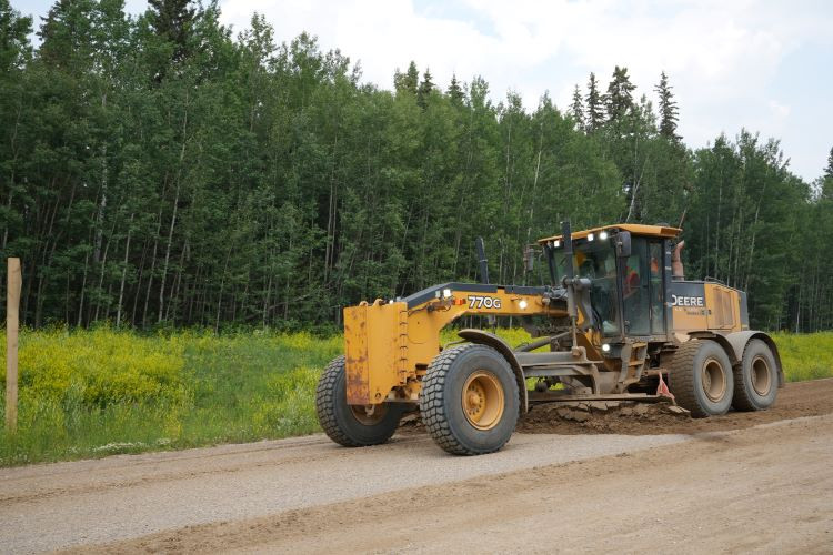 Heavy equipment remediating sections of Highway 686 