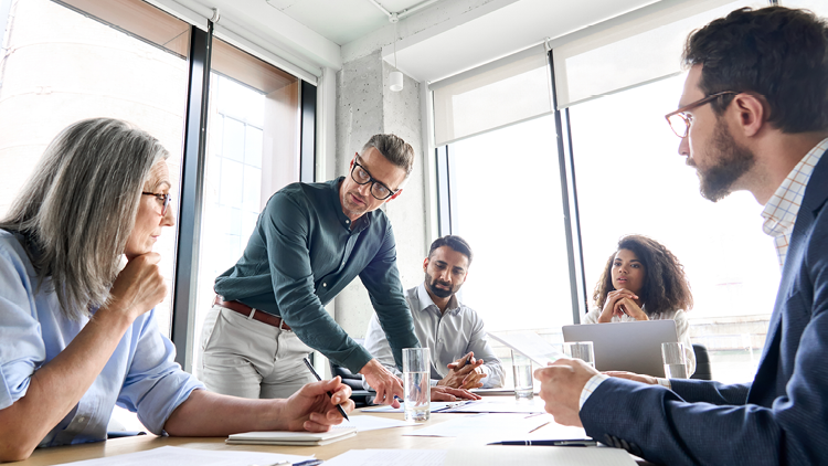 Photo of people around a boardroom table