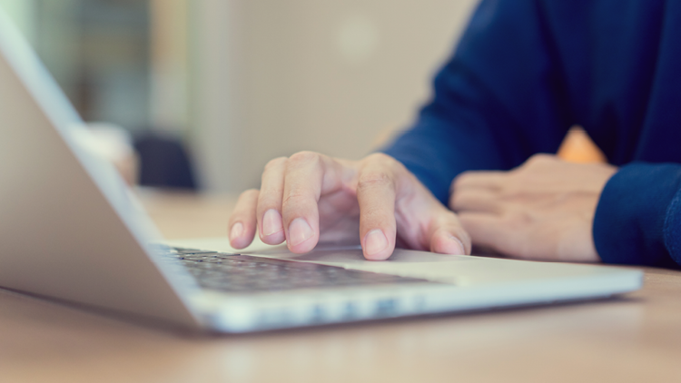 Photo of a person on a laptop computer